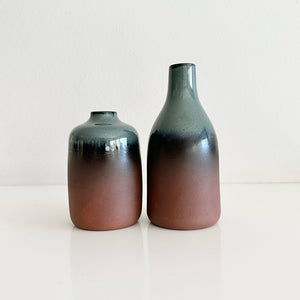 Two ceramic vases with gradient coloring on a white background