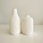 Load image into Gallery viewer, Two textured white vases on a light surface with a neutral background
