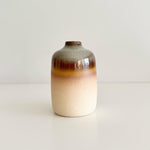Load image into Gallery viewer, Ceramic vase with gradient color from brown to beige on a light background
