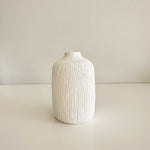 Load image into Gallery viewer, White textured vase on a light beige background

