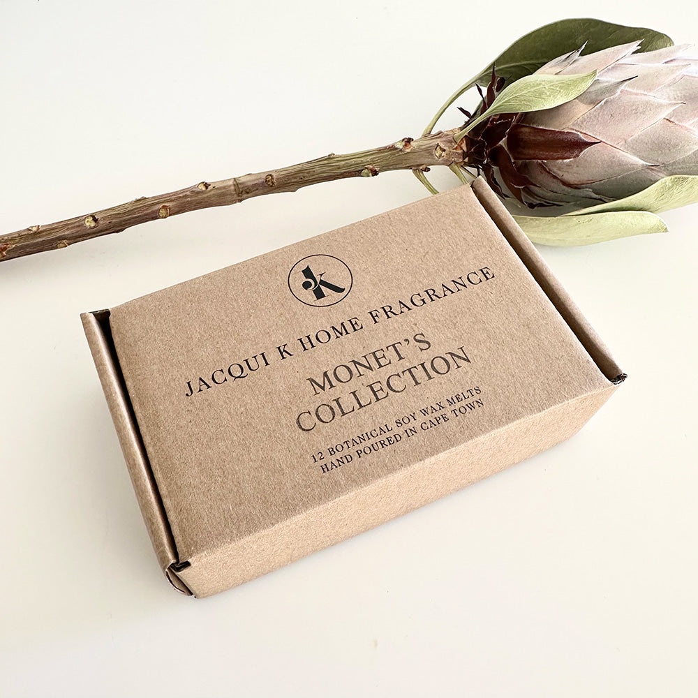 Jacqui K Home Fragrance Monet's Collection packaging with a flower on a light background
