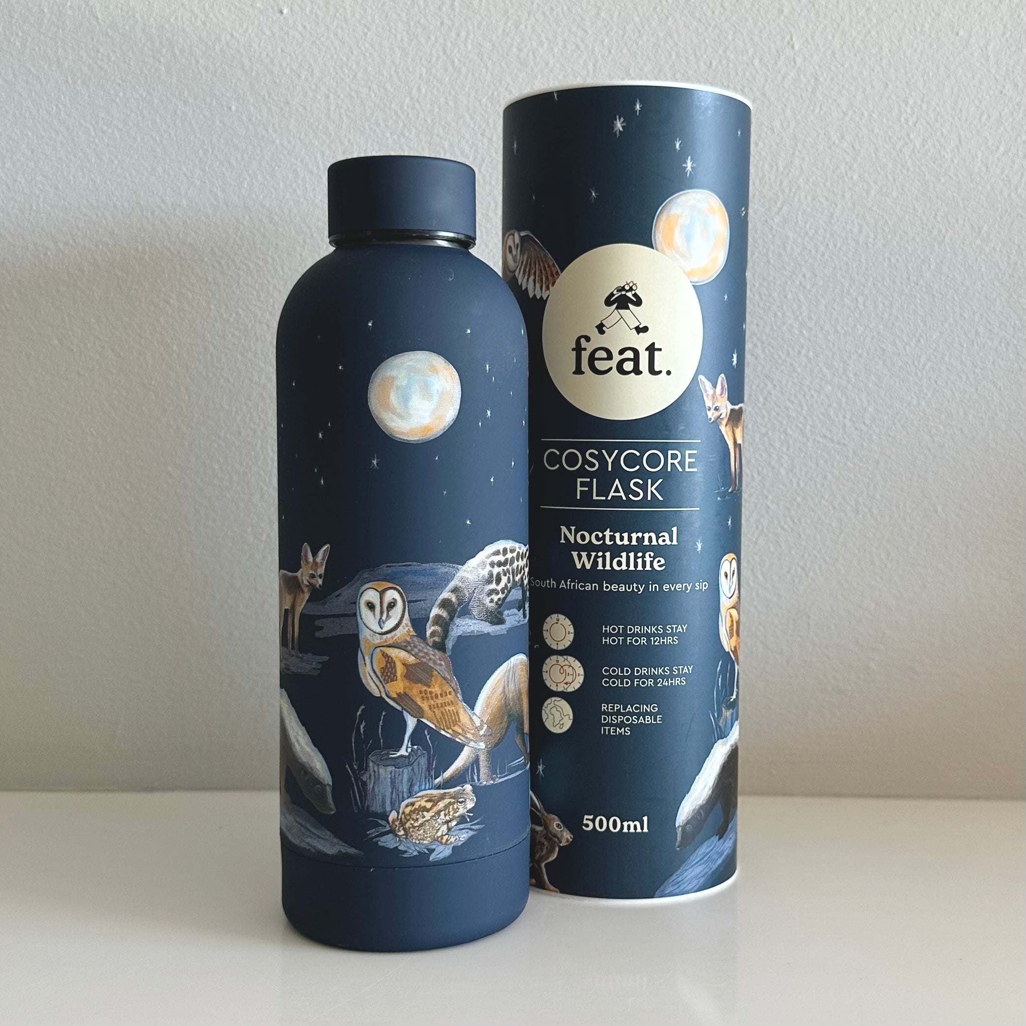 A dark blue CosyCore flask featuring nocturnal animal and bird illustrations.