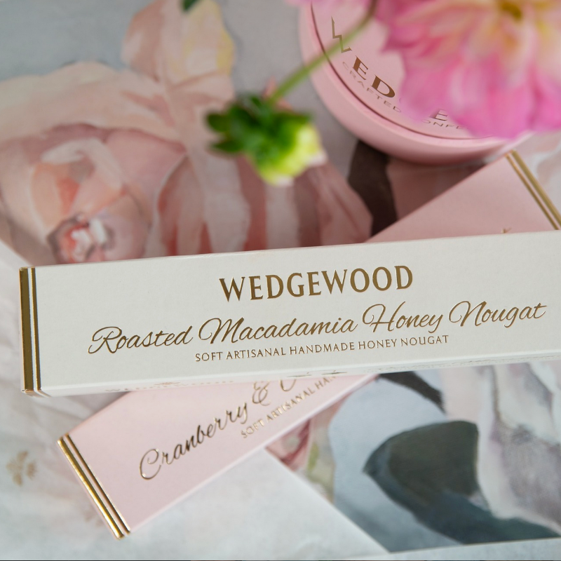 Wedgewood roasted macadamia honey & cranberry and almond nougat boxes with floral background