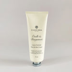 Load image into Gallery viewer, A tube of Charisma brand oud and bergamot luxury hand and nail cream, with the label indicating it is scented with natural essences.
