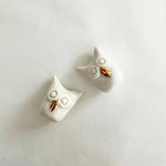 Load image into Gallery viewer, A pair of handcrafted ceramic owls with gold accents displayed on a white background.
