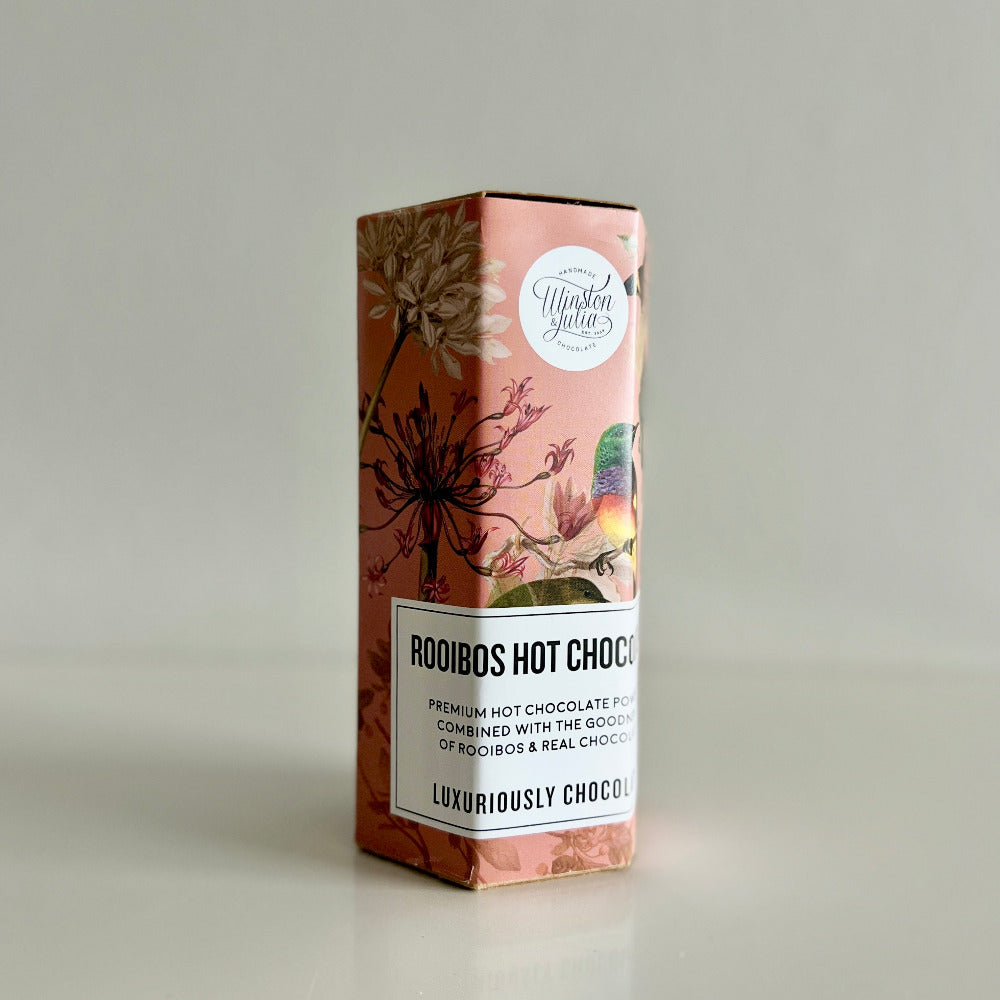 Box of Rooibos Hot Chocolate with floral design on a gray background