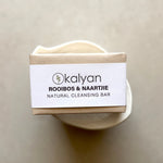 Load image into Gallery viewer, Kalyan natural cleansing bar with a white label on a beige background
