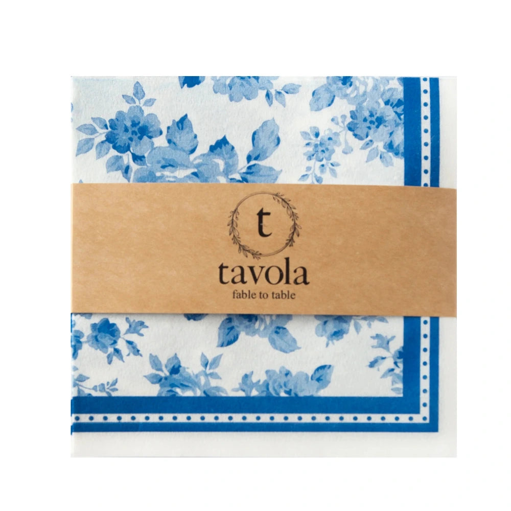 Packaged blue floral napkins with a Tavola label on a white background