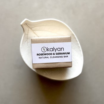 Kalyan Rosewood & Geranium natural cleansing bar on a beige background