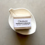 Load image into Gallery viewer, Kalyan Rosewood &amp; Geranium natural cleansing bar on a beige background
