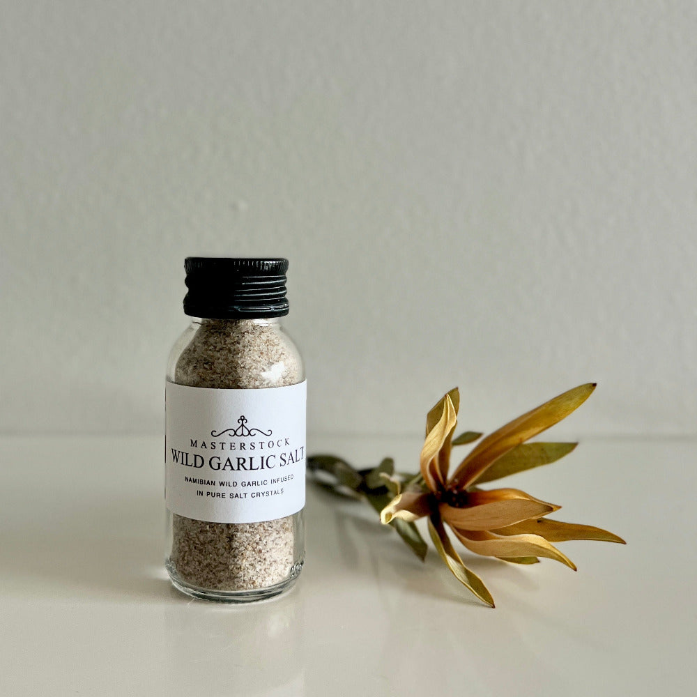 Bottle of Masterstock Wild Garlic Salt on a light surface with a neutral background