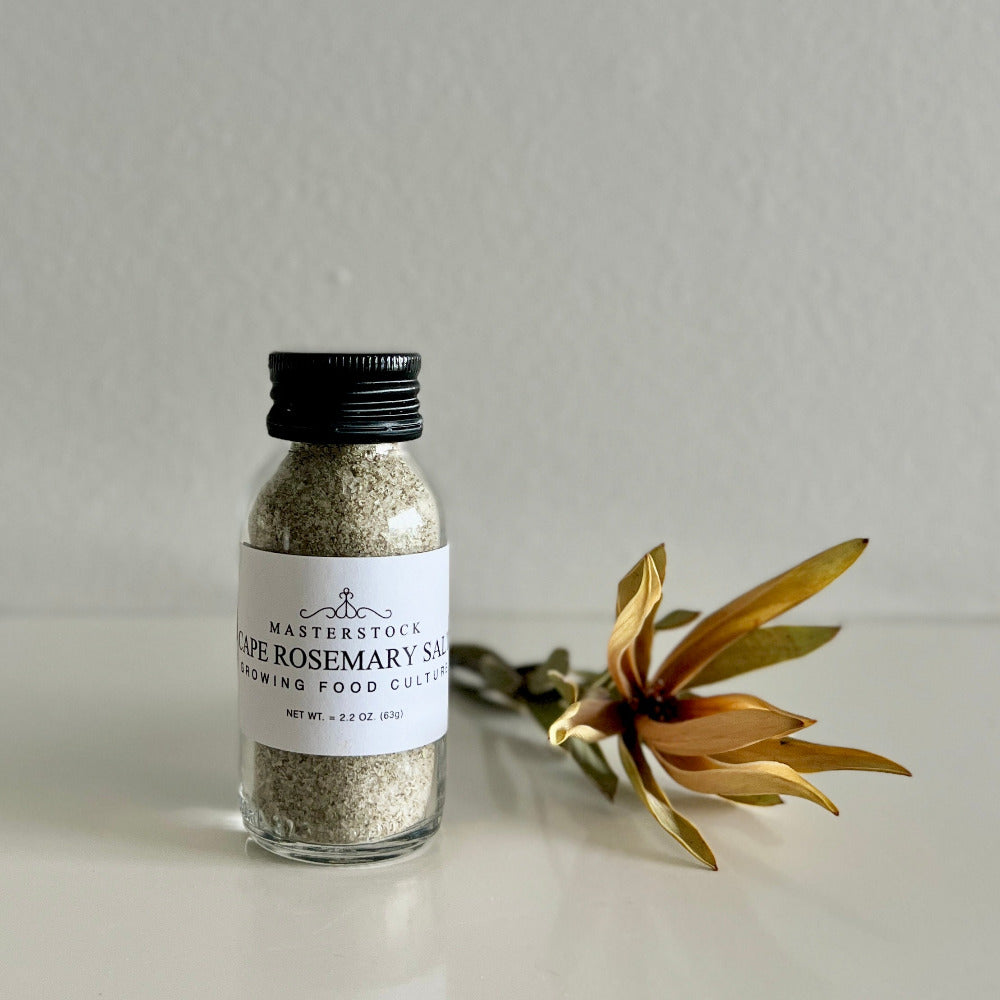 Bottle of Cape Rosemary Salt with a label on a light gray background