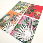 Load image into Gallery viewer, Four cards with floral designs on a white background

