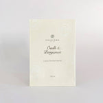 Load image into Gallery viewer, A cream coloured sachet with the title &#39;OUDH &amp; BERGAMOT LUXURY SCENTED SACHET&#39; in silver foiling.
