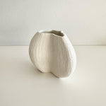 Load image into Gallery viewer, White ceramic vase on a light gray background

