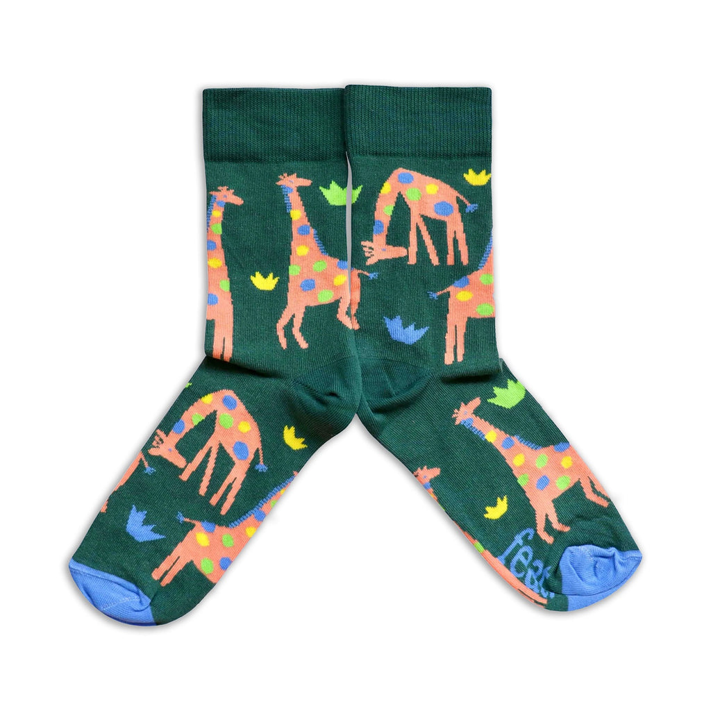 Green socks with colorful giraffe pattern on a white background