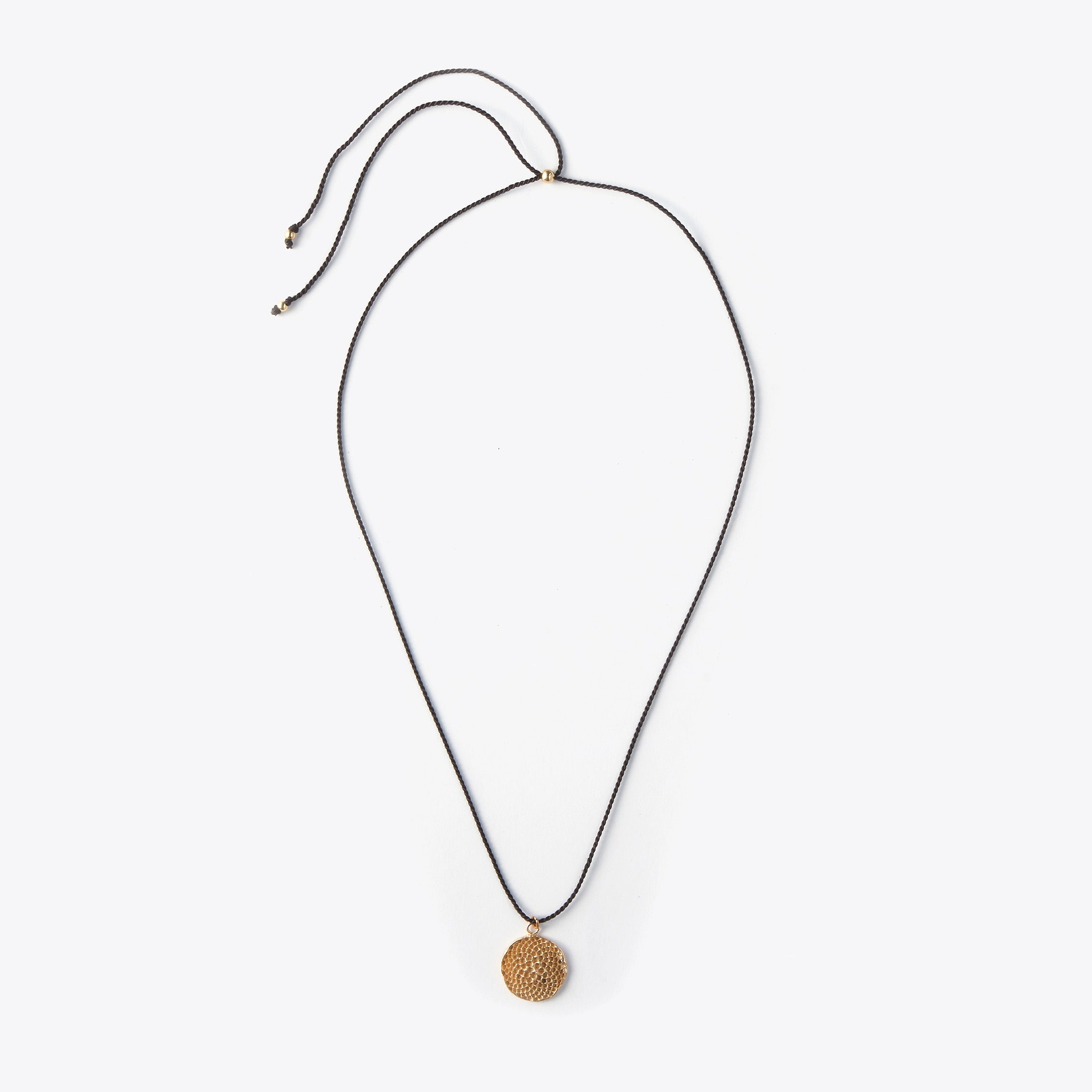 Necklace with a bronze pendant on a white background