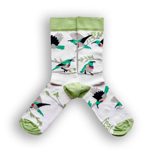 A pair of beige and green cotton socks with an illustration of Lesser Double-collared Sunbirds.