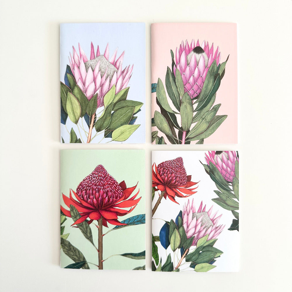 Four cards with floral designs on a white background