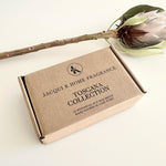 Load image into Gallery viewer, Jacqui K Home Fragrance Toscana Collection box with a king protea on a light background
