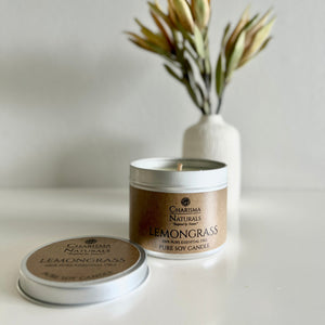 Charisma Naturals Lemongrass candle with packaging on a neutral background
