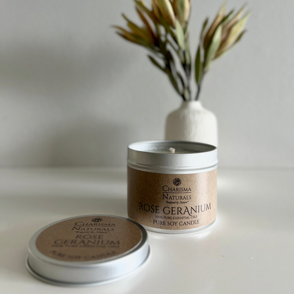 Rose Geranium candle with packaging on a neutral background