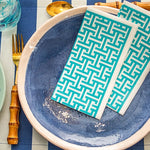 Load image into Gallery viewer, Turquoise patterned napkins on a blue plate with cutlery.

