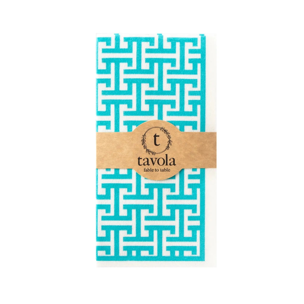 Turquoise and white patterned napkin with a brown label on a white background.