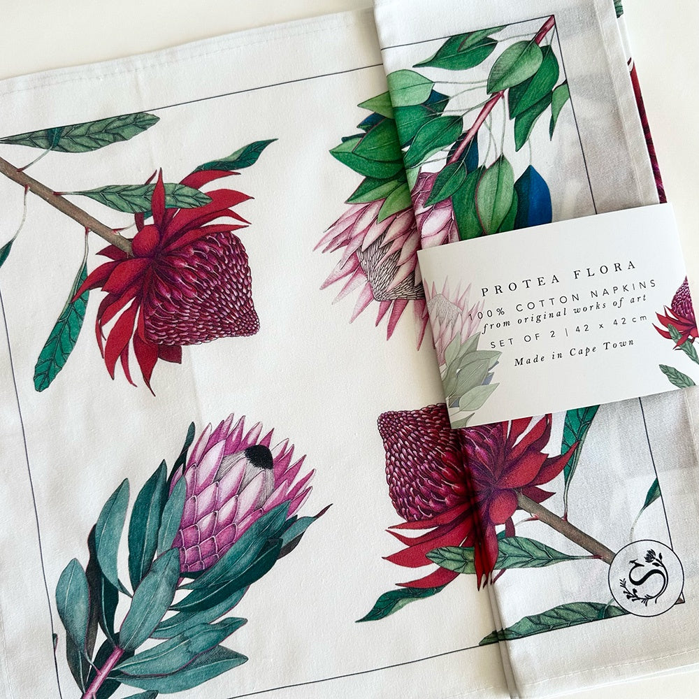 Protea white cotton napkins with protea design on a white background