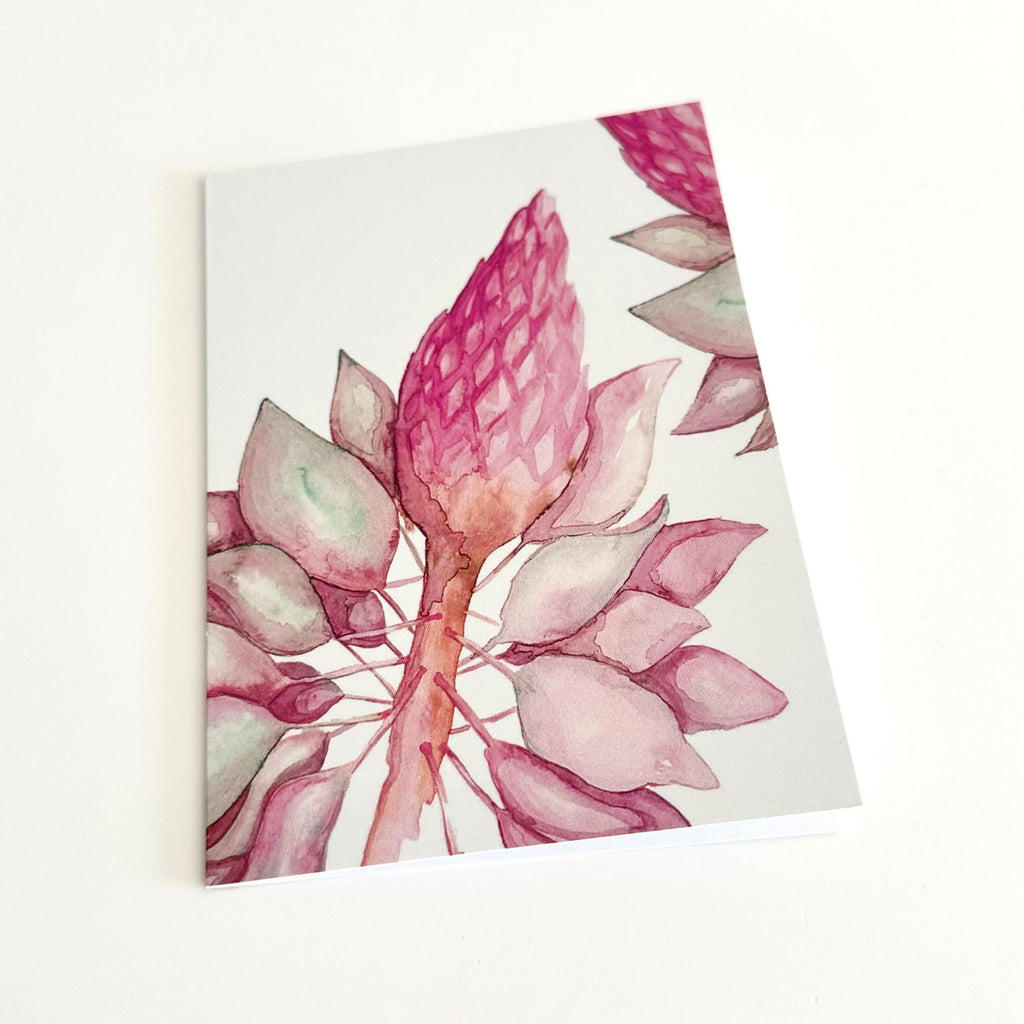 A6 greeting card of a floral watercolour with pink and green tones on a white background