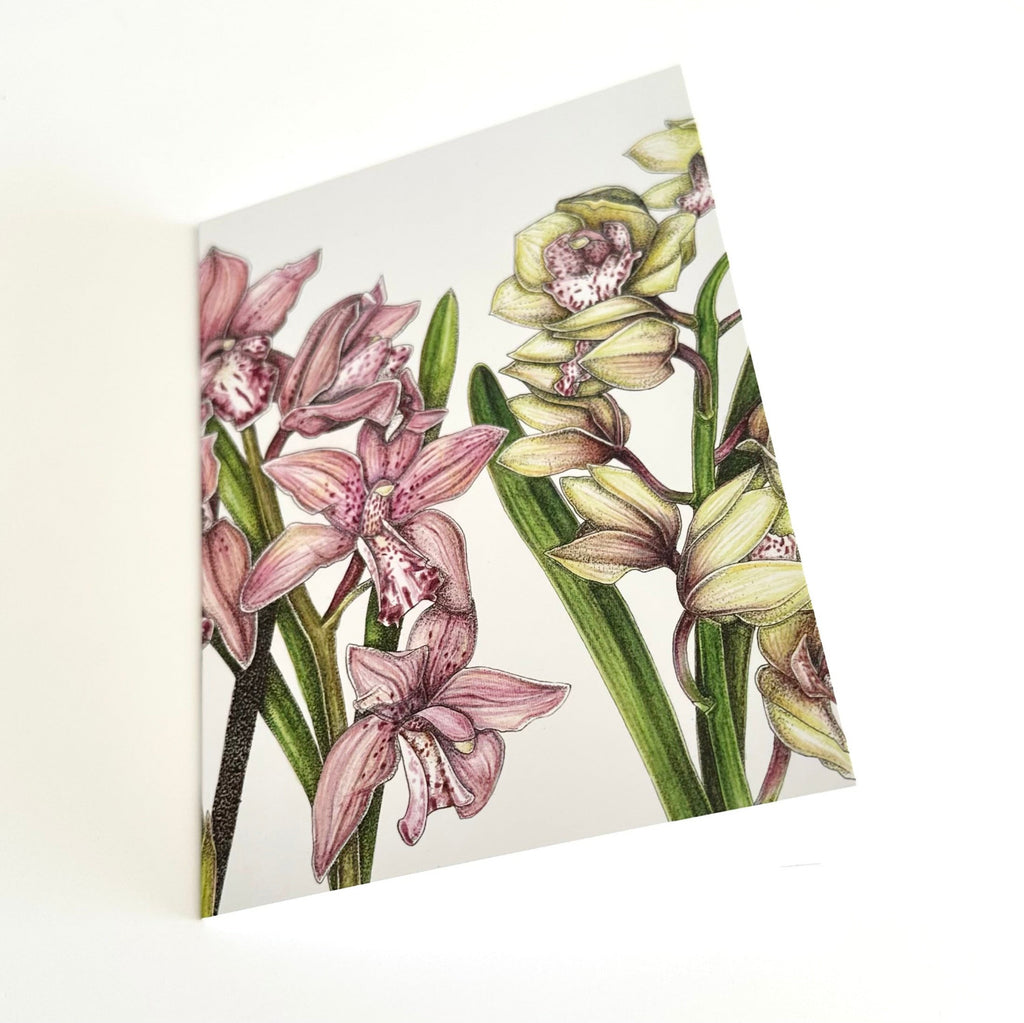 A6 greeting card with pink and green orchid design on a white background