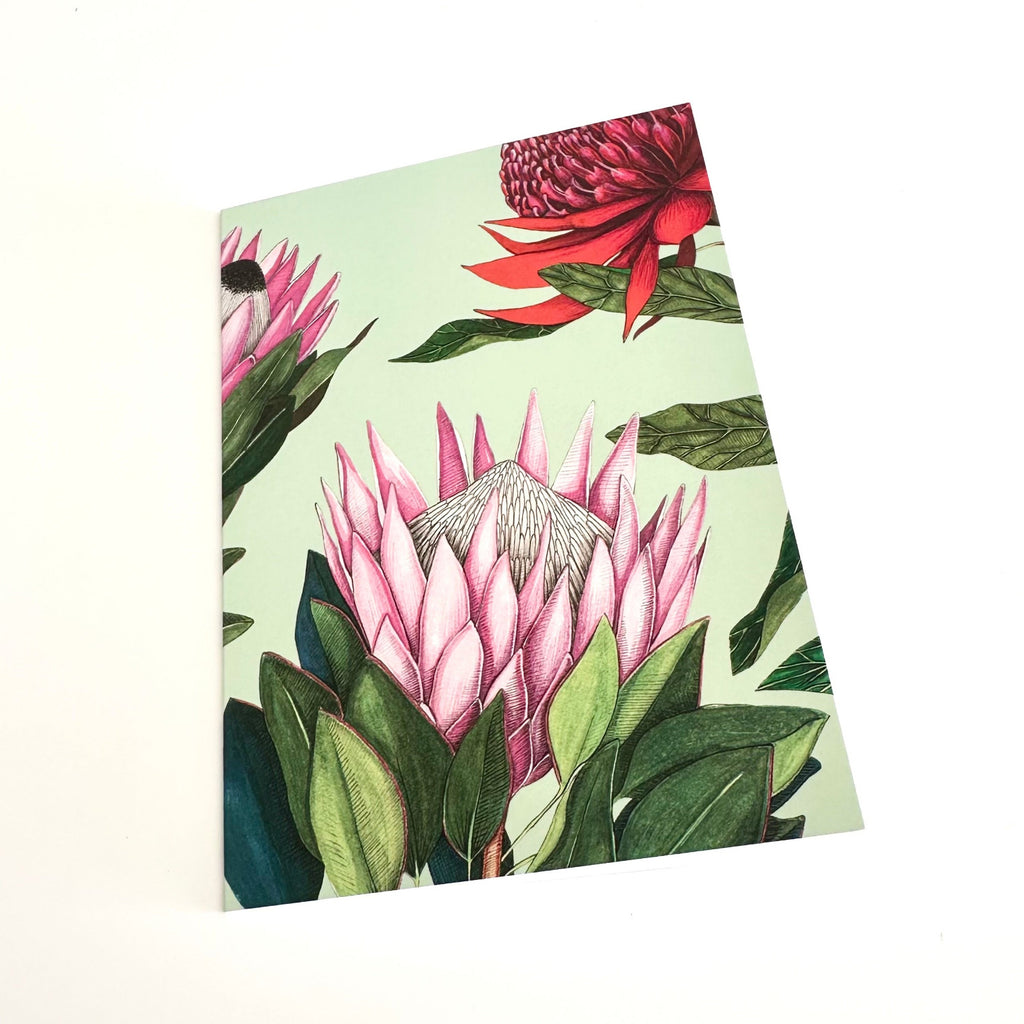 A6 greeting card with pink and red floral design on a light green background