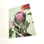 Load image into Gallery viewer, Floral design on a light green background
