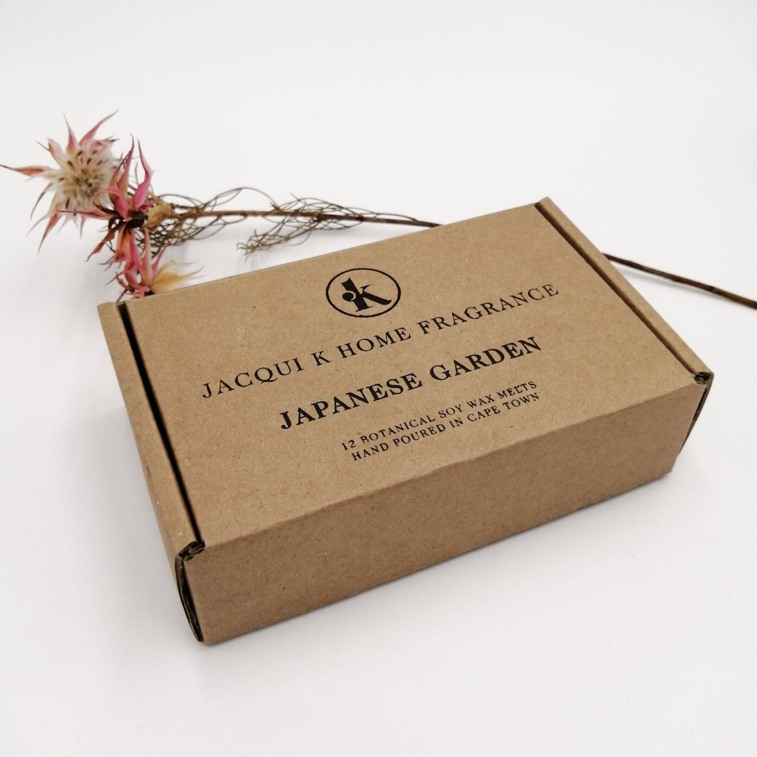Brown box with 'Jacqui K Home Fragrance' branding on a white background