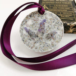 Load image into Gallery viewer, Decorative wax tablet with lavender tips and a purple ribbon, with a box labeled &#39;Scented Wax Tablet Lavender&#39; in the background.
