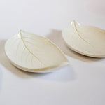 Load image into Gallery viewer, Two porcelain leaf-shaped dishes on a white background.
